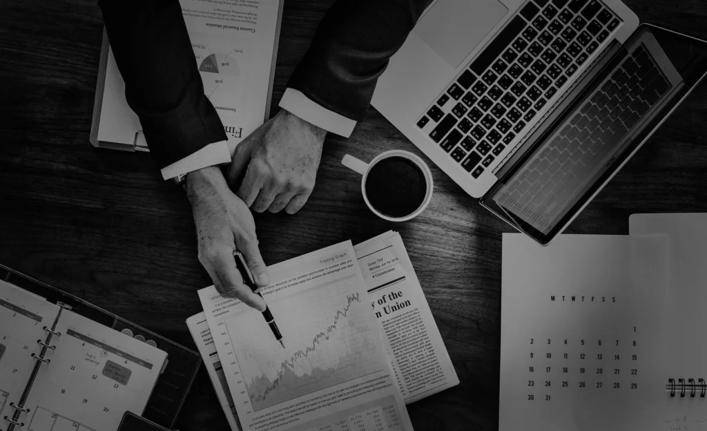 Digital Marketing data analysis showing business growth charts, laptop, and workspace setup